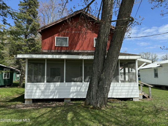 113 Forest Ave, Caroga, NY 12032 - view of property exterior featuring a yard and a sunroom