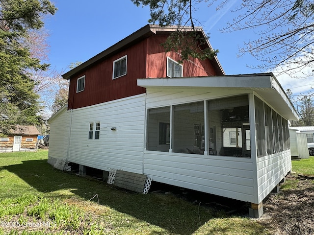 113 Forest Ave, Caroga, NY 12032 - view of side of home with a lawn and a sunroom