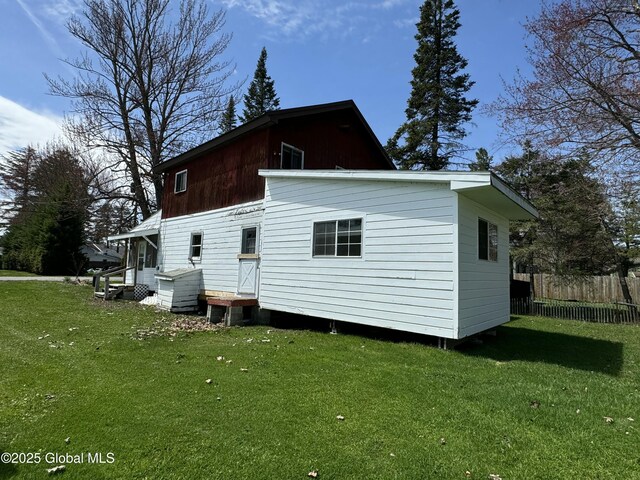 113 Forest Ave, Caroga, NY 12032 - rear view of house with a yard, fence, and entry steps