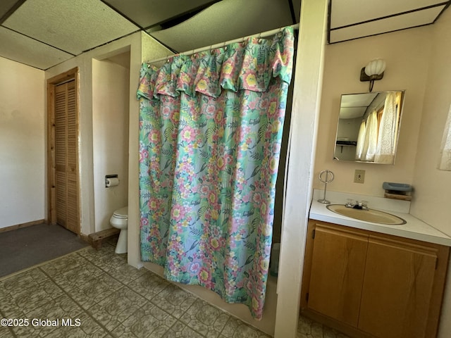 113 Forest Ave, Caroga, NY 12032 - bathroom featuring vanity, tile patterned floors, shower / bath combo with shower curtain, and toilet