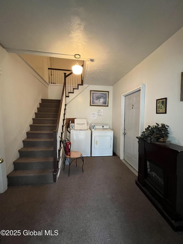 interior space featuring independent washer and dryer and carpet flooring