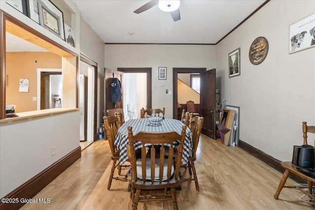 209 Lake Ave, Lake Luzerne, NY 12846 - dining space featuring light wood-type flooring, a ceiling fan, and baseboards