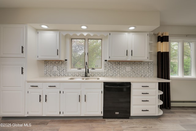 16 Van Heusen St, Colonie, NY 12205 - kitchen featuring dishwasher, a sink, light countertops, plenty of natural light, and recessed lighting