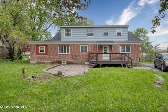 16 Van Heusen St, Colonie, NY 12205 - rear view of property with a patio, a lawn, a wooden deck, and brick siding