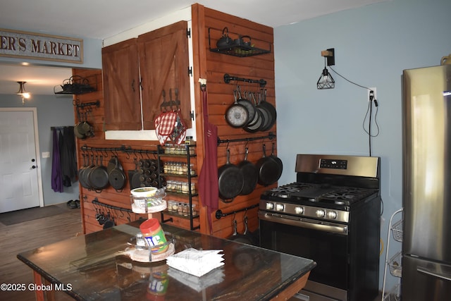 kitchen featuring wood finished floors and stainless steel appliances