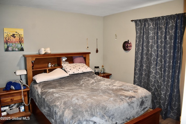 bedroom featuring wood finished floors