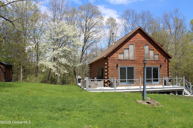 127 Fording Rd, Esperance, NY 12066 - rear view of house featuring a lawn, a deck, and log siding