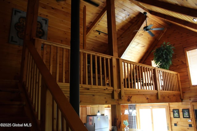 127 Fording Rd, Esperance, NY 12066 - details with freestanding refrigerator, beamed ceiling, ceiling fan, wooden walls, and wood ceiling