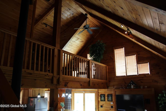 127 Fording Rd, Esperance, NY 12066 - room details with freestanding refrigerator, wood ceiling, beam ceiling, and wooden walls