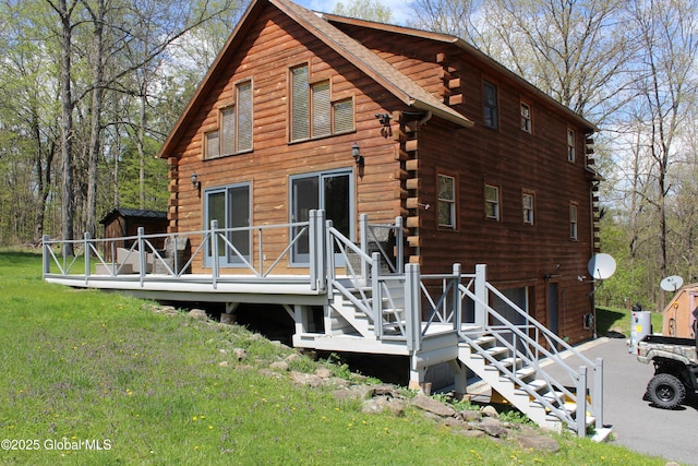 127 Fording Rd, Esperance, NY 12066 - rear view of property with a lawn, a wooden deck, stairway, and log siding