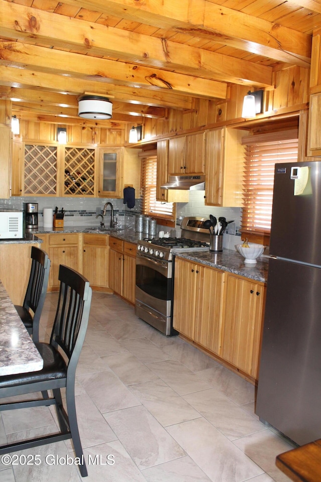 127 Fording Rd, Esperance, NY 12066 - kitchen with decorative backsplash, a sink, beamed ceiling, under cabinet range hood, and stainless steel appliances