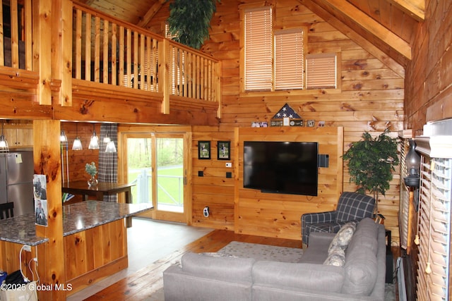 127 Fording Rd, Esperance, NY 12066 - living room with wood-type flooring, wooden walls, and vaulted ceiling