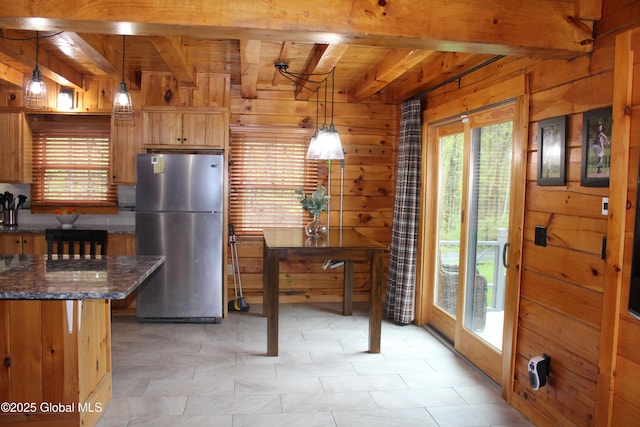 127 Fording Rd, Esperance, NY 12066 - kitchen featuring wooden ceiling, beamed ceiling, freestanding refrigerator, and wood walls