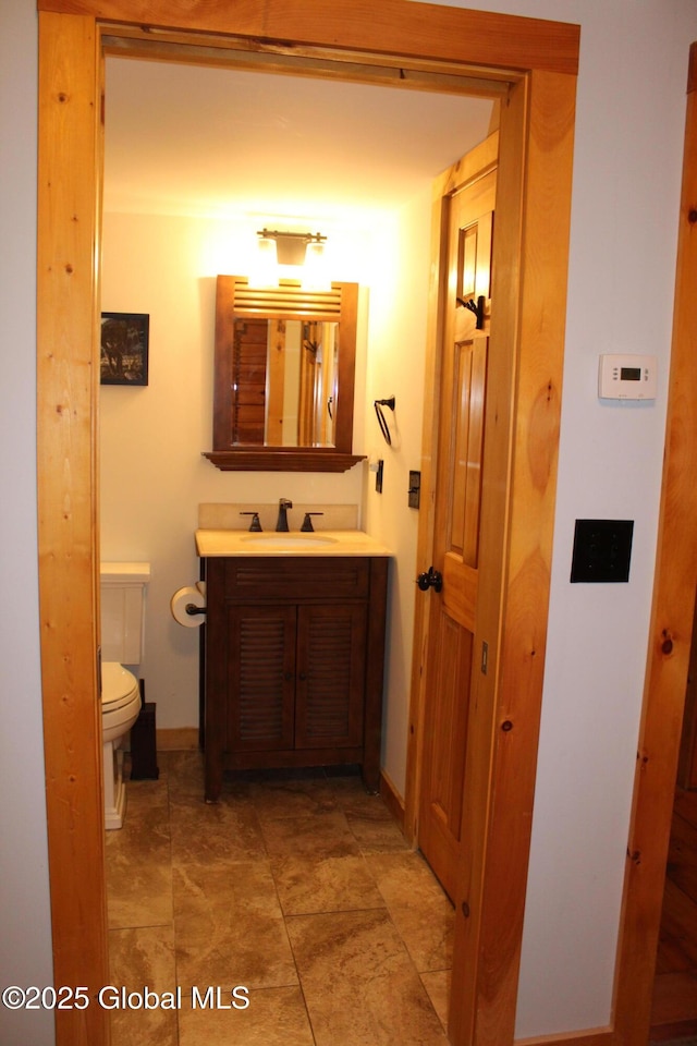 127 Fording Rd, Esperance, NY 12066 - half bath with vanity, baseboards, and toilet