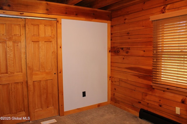127 Fording Rd, Esperance, NY 12066 - unfurnished room featuring visible vents, carpet, baseboards, and wooden walls