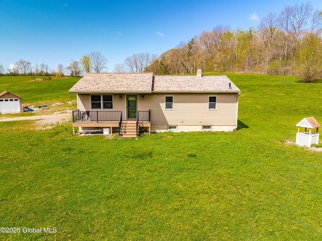 back of house with a yard and a wooden deck