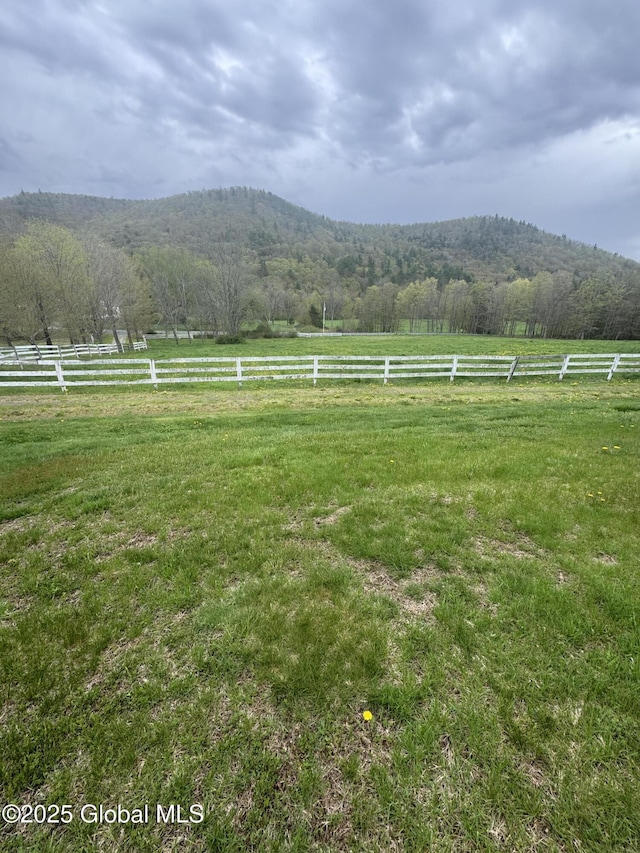 view of mountain feature with a rural view