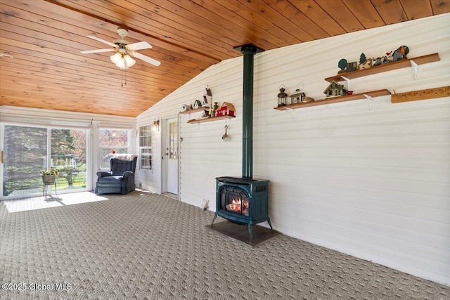 unfurnished sunroom featuring a wood stove