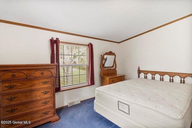 bedroom with dark colored carpet, baseboards, vaulted ceiling, visible vents, and ornamental molding