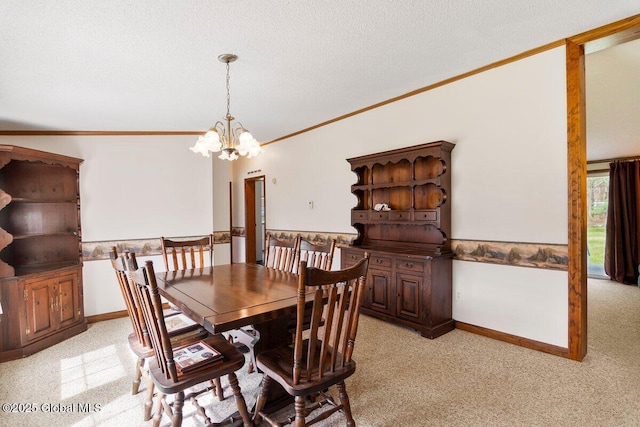 dining room with crown molding, a textured ceiling, a notable chandelier, and light carpet