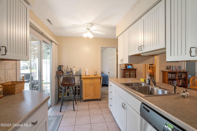 kitchen with ceiling fan, visible vents, dishwasher, a sink, and light tile patterned floors