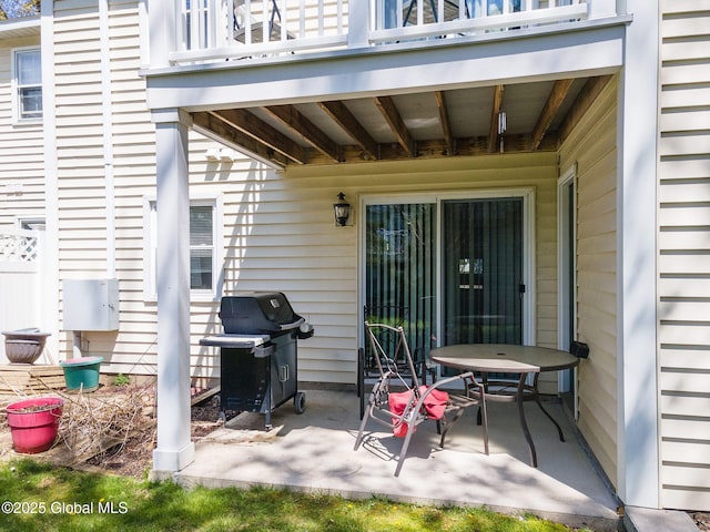 view of patio / terrace with a balcony and area for grilling