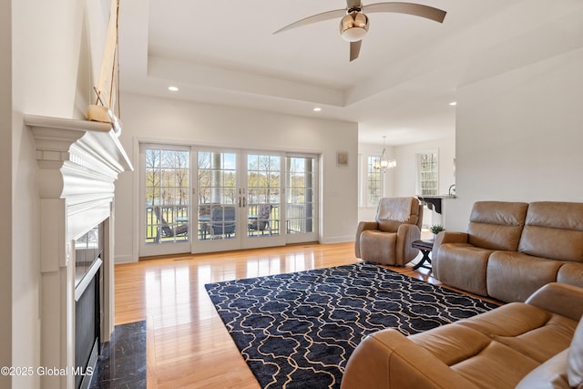 3 Riverside Ct, Stillwater, NY 12170 - living area featuring recessed lighting, baseboards, ceiling fan with notable chandelier, a high end fireplace, and wood finished floors