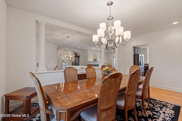 3 Riverside Ct, Stillwater, NY 12170 - dining area with recessed lighting, baseboards, an inviting chandelier, wood finished floors, and ornate columns