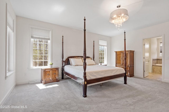3 Riverside Ct, Stillwater, NY 12170 - bedroom featuring a chandelier, light carpet, connected bathroom, and baseboards