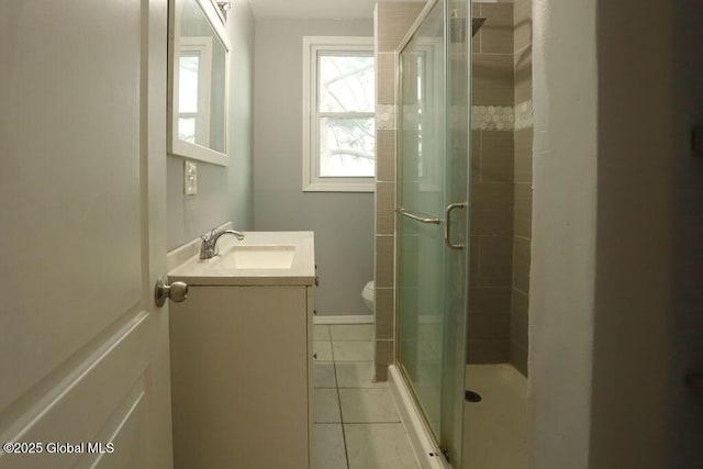full bathroom with tile patterned flooring, a stall shower, vanity, and toilet