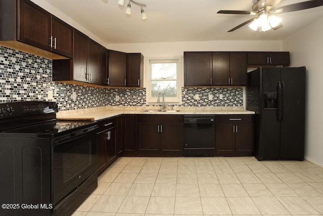 kitchen featuring black appliances, a sink, light countertops, and dark brown cabinets