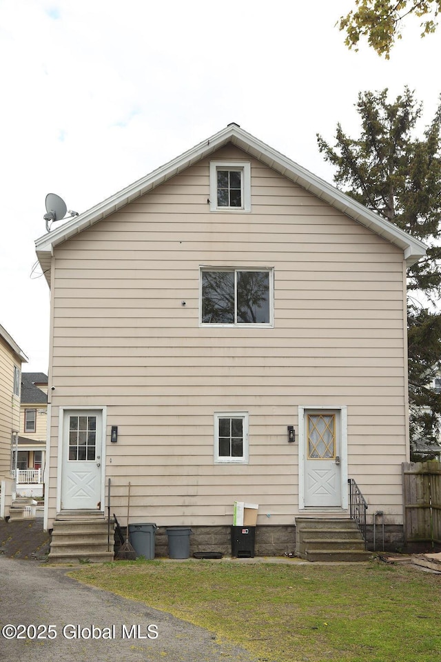 rear view of property with entry steps