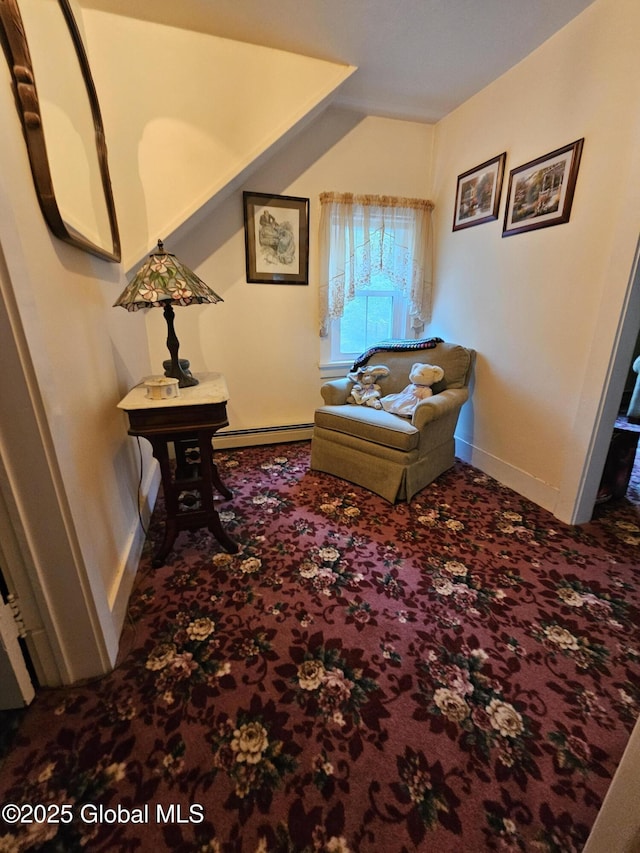 sitting room featuring baseboards, carpet, and a baseboard heating unit