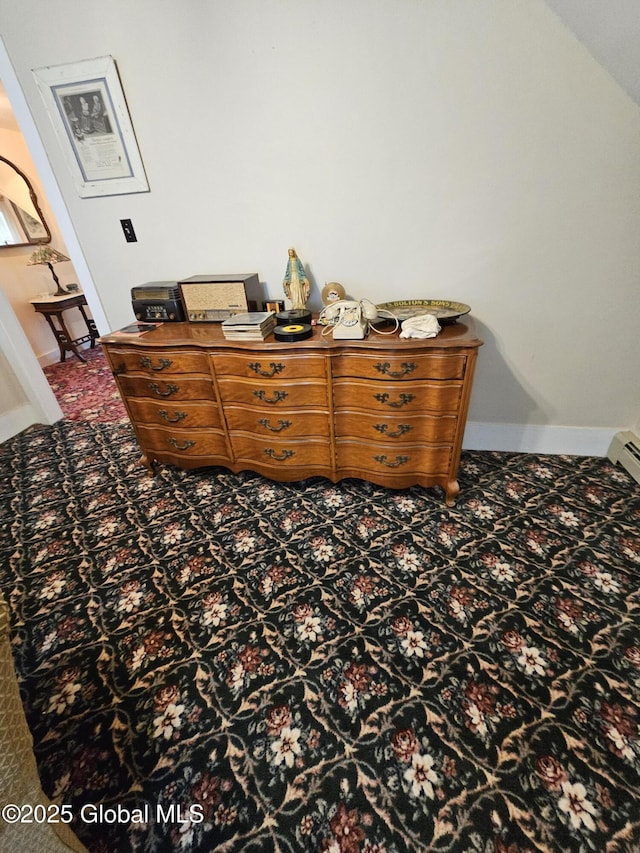 details with baseboards and carpet