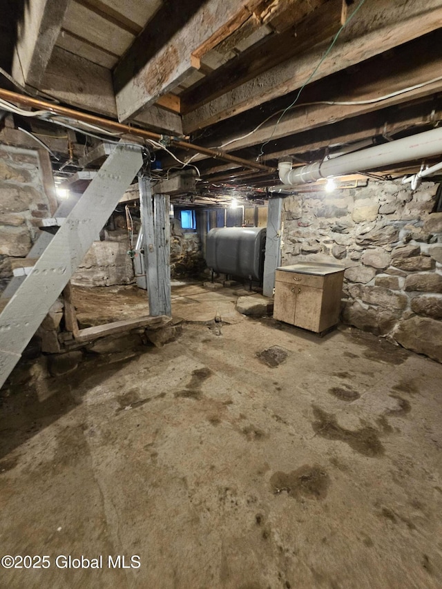 unfinished below grade area featuring heating fuel