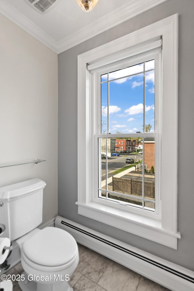 half bathroom with toilet, visible vents, a baseboard heating unit, marble finish floor, and ornamental molding