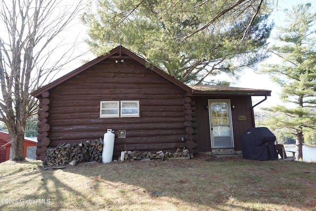 back of house with log siding
