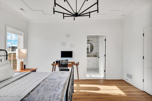 53 Wardley Cir, Colonie, NY 12047 - bedroom featuring light wood-style floors, a chandelier, baseboards, and ensuite bath