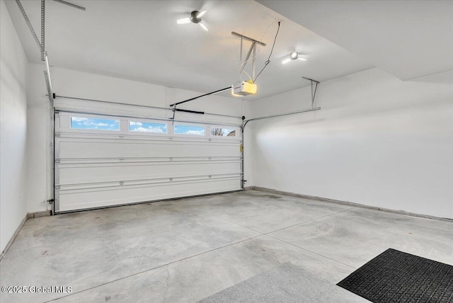 53 Wardley Cir, Colonie, NY 12047 - garage featuring a garage door opener and baseboards