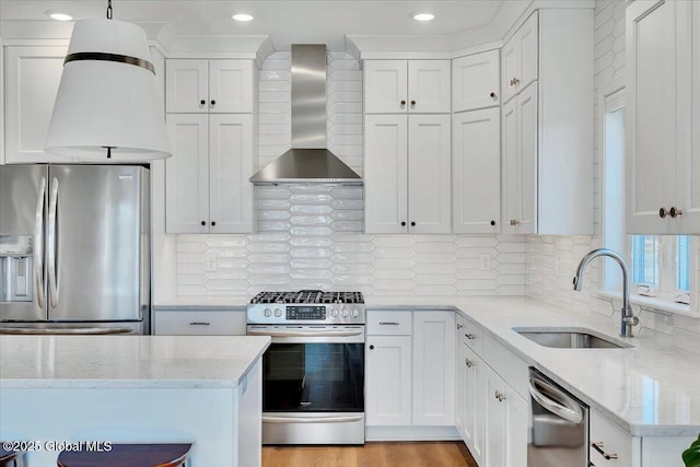 53 Wardley Cir, Colonie, NY 12047 - kitchen with wall chimney exhaust hood, stainless steel appliances, a sink, white cabinets, and light stone counters