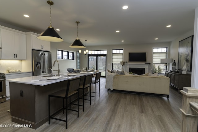7 Magnolia Dr, Halfmoon, NY 12065 - kitchen featuring dark wood-style flooring, recessed lighting, high end refrigerator, and plenty of natural light