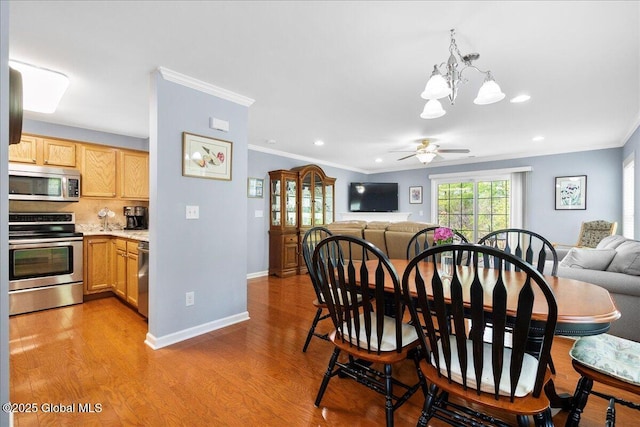 51 Treasures Pl, Queensbury, NY 12804 - dining area featuring crown molding, ceiling fan with notable chandelier, light wood-type flooring, and recessed lighting