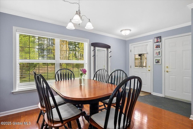 51 Treasures Pl, Queensbury, NY 12804 - dining space with an inviting chandelier, ornamental molding, baseboards, and dark wood finished floors