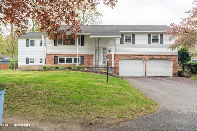 27 Patricia Ln, Saratoga Springs, Inside, NY 12866 - split foyer home with brick siding, a garage, driveway, and a front yard