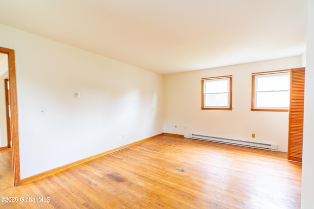27 Patricia Ln, Saratoga Springs, Inside, NY 12866 - unfurnished room featuring a baseboard heating unit, light wood finished floors, and baseboards