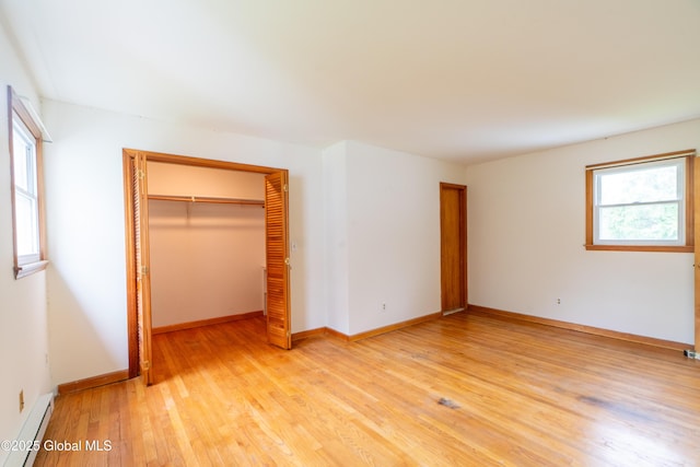 27 Patricia Ln, Saratoga Springs, Inside, NY 12866 - unfurnished bedroom with a baseboard heating unit, light wood-style flooring, a closet, and baseboards