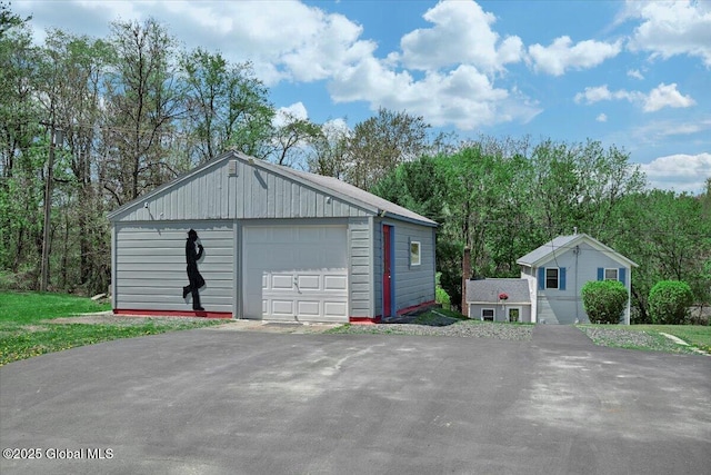 detached garage featuring driveway