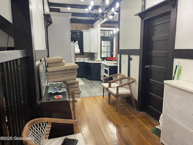interior space featuring a chandelier and light wood-type flooring