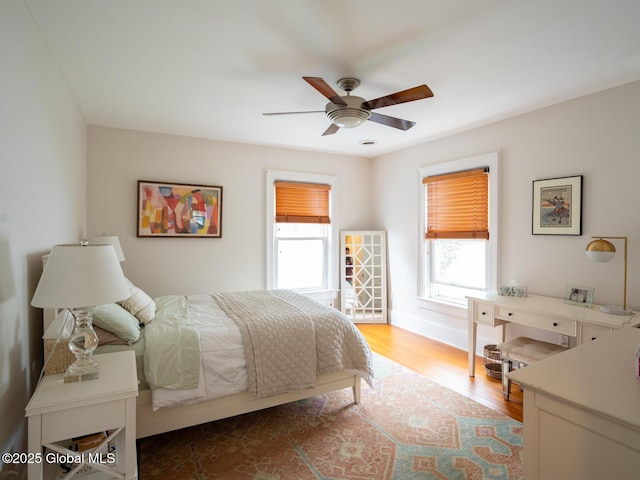 33 Broadway, Rensselaer, NY 12144 - bedroom with wood finished floors, ceiling fan, and baseboards