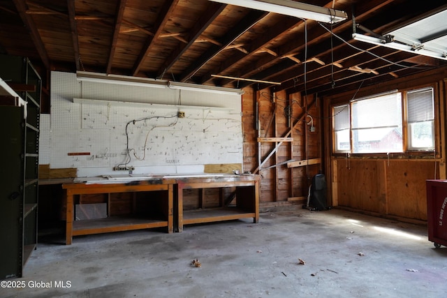 6222 Rte 9n, Hadley, NY 12835 - garage featuring a workshop area and wood walls